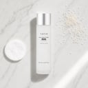 Tirtir Milk Skin Toner Light on surface with cotton pad