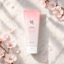 Beauty of Joseon Apricot Peeling Gel on surface with apricot blossoms