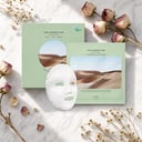 Dr Althea Oasis Soothing Mask packets on surface with botanical elements