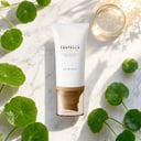 Skin1004 Air-Fit Suncream Light on surface with centella and sun elements