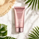 Medicube Collagen Firming Sun Cream on surface with sunlight