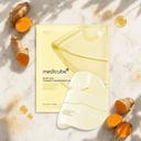 Medicube Kojic Acid Turmeric Gel Mask packets with golden jelly texture