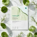 Medicube Super Cica Calming Mask with centella leaves on surface