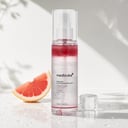 Medicube PDRN Pink Glutathione Serum Mist on vanity with skincare products