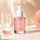 Anua Peach 70 Niacin Serum on vanity with brightening routine