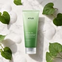 Anua Heartleaf Quercetinol Foam on surface with green elements