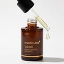 Medicube AGE-R Glutathione Serum clear droplets on glass surface