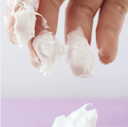 Applying Eqqualberry Bakuchiol Cream - capsules bursting on hands