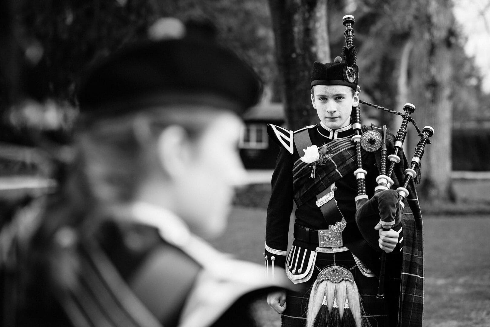 Bagpiper stands to attention