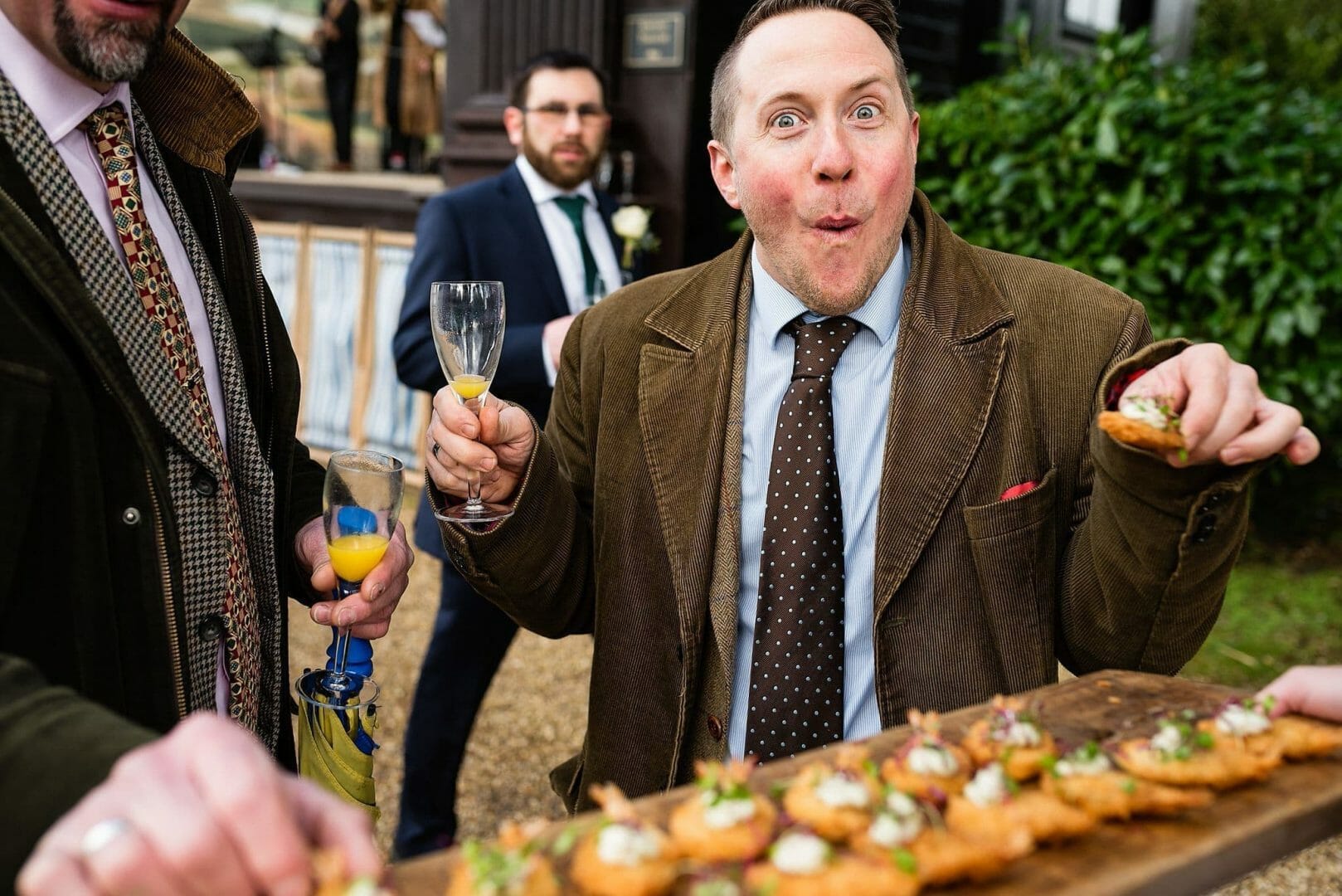 Eating canapés at Larmer tree Gardens in Wiltshire