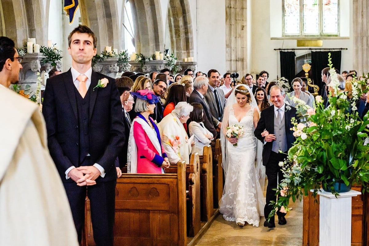 Bride and groom holding back the tears