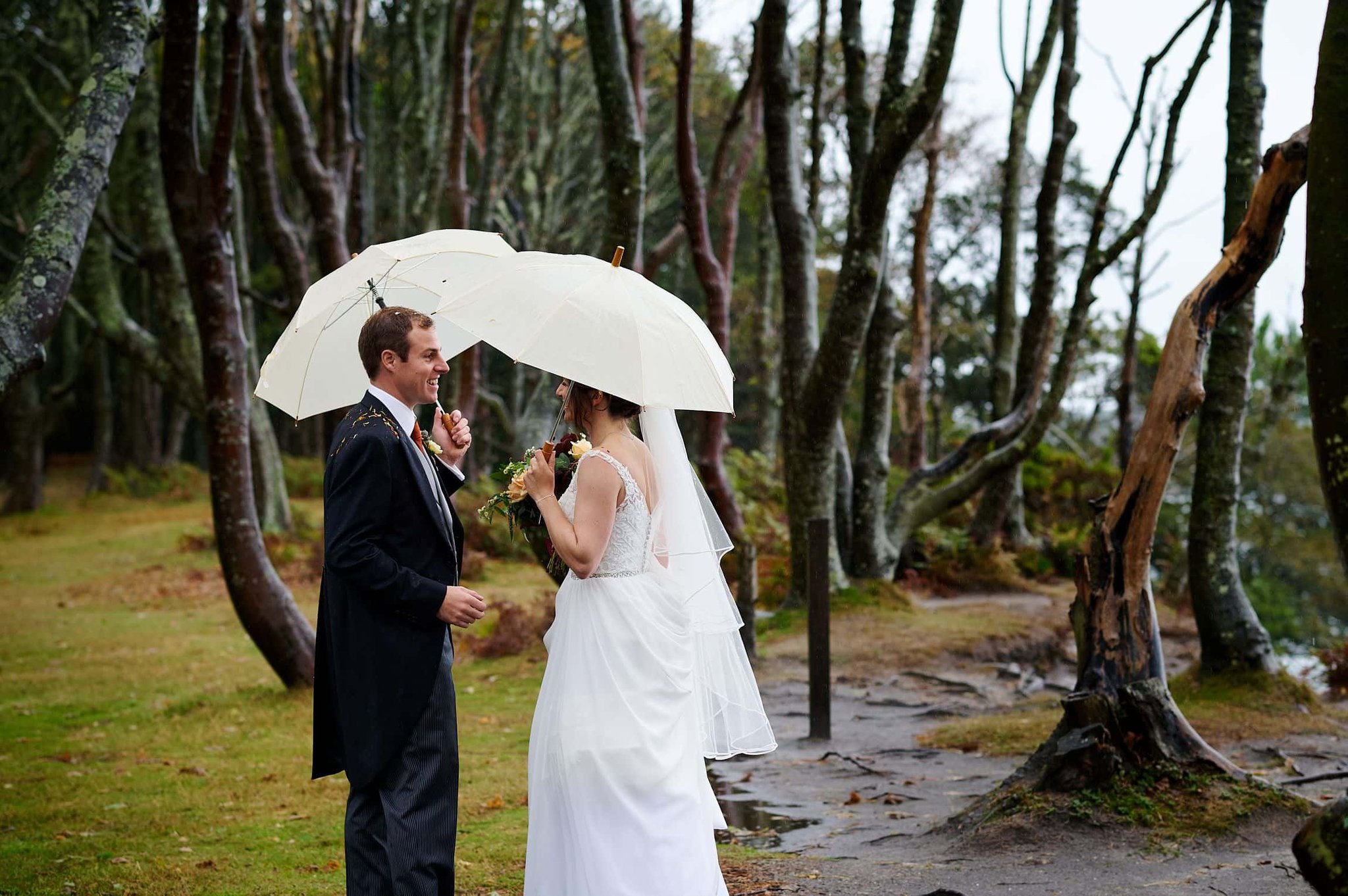 Bride and Groom in rain at Brownsea Island wedding