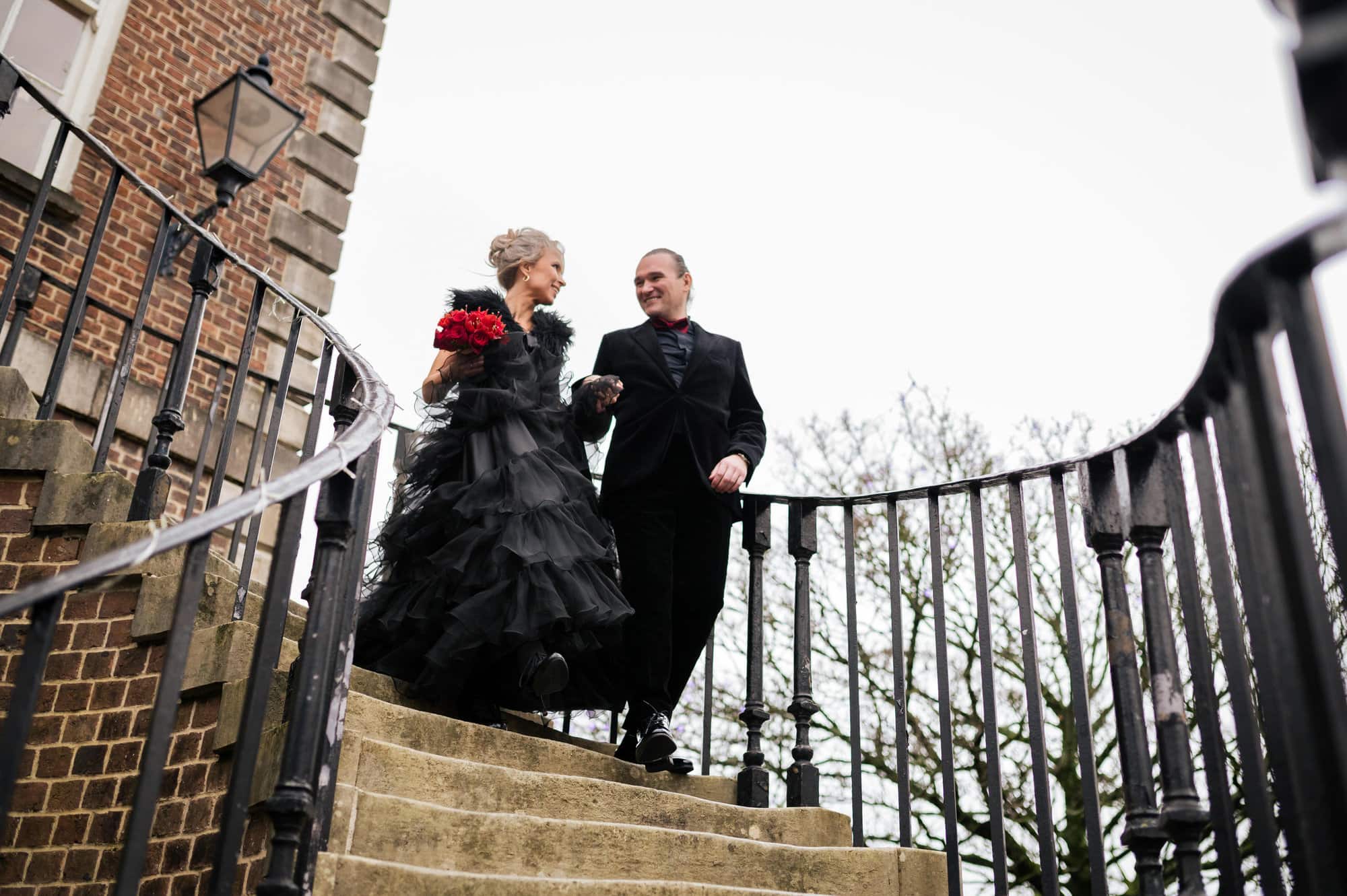Black and red wedding at Poole Guildhall steps in Dorset