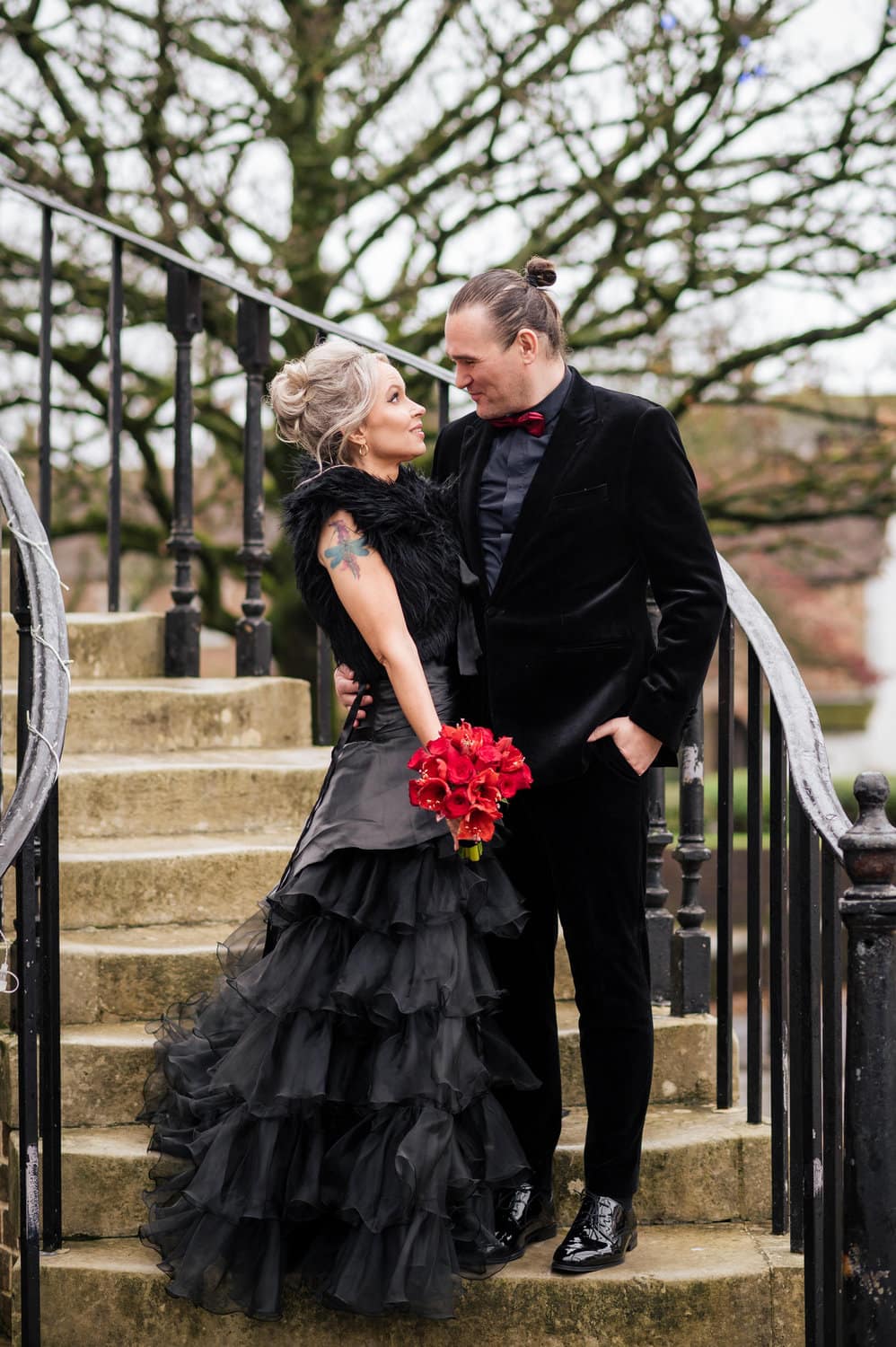 Bride and Groom in Black on Poole Guildhall steps - Goth Wedding