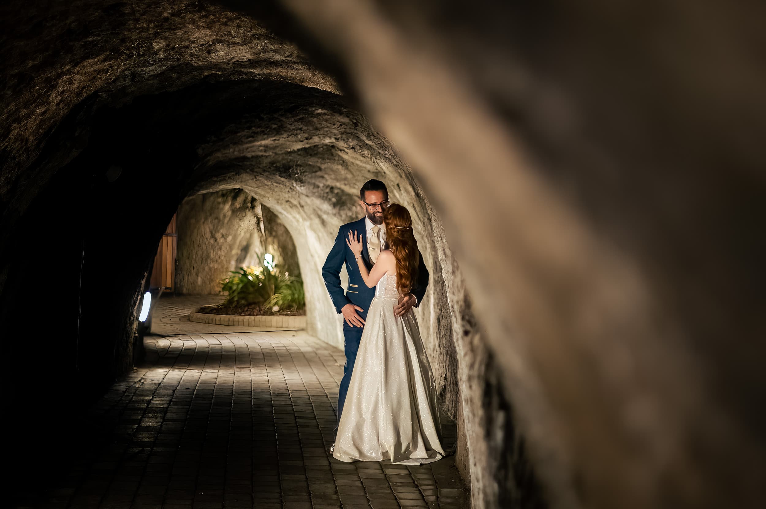 Bride and groom in the tunnels at Tunnels Beaches Wedding venue