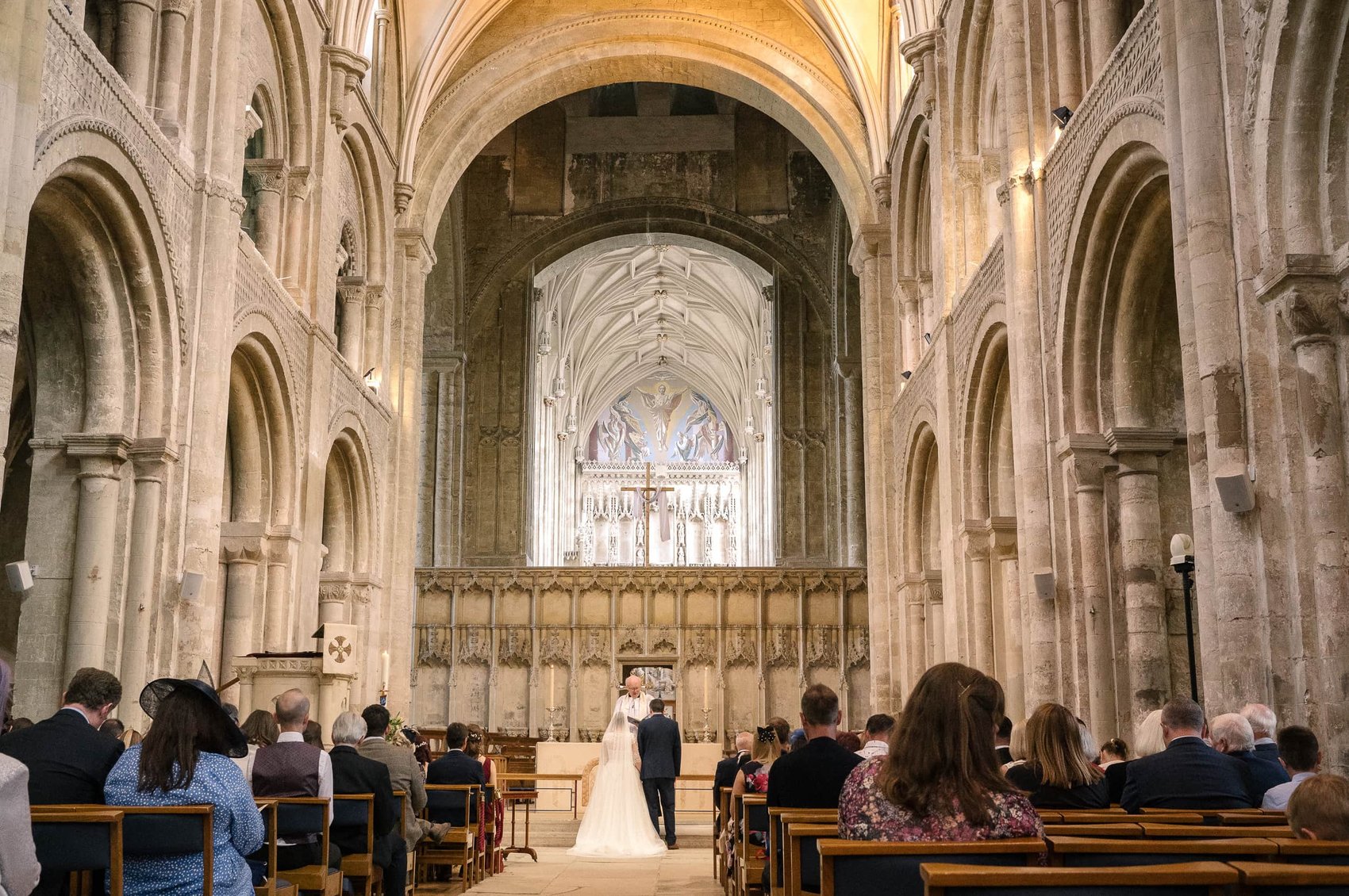 Christchurch Priory wedding ceremony from the ttop of the aisle