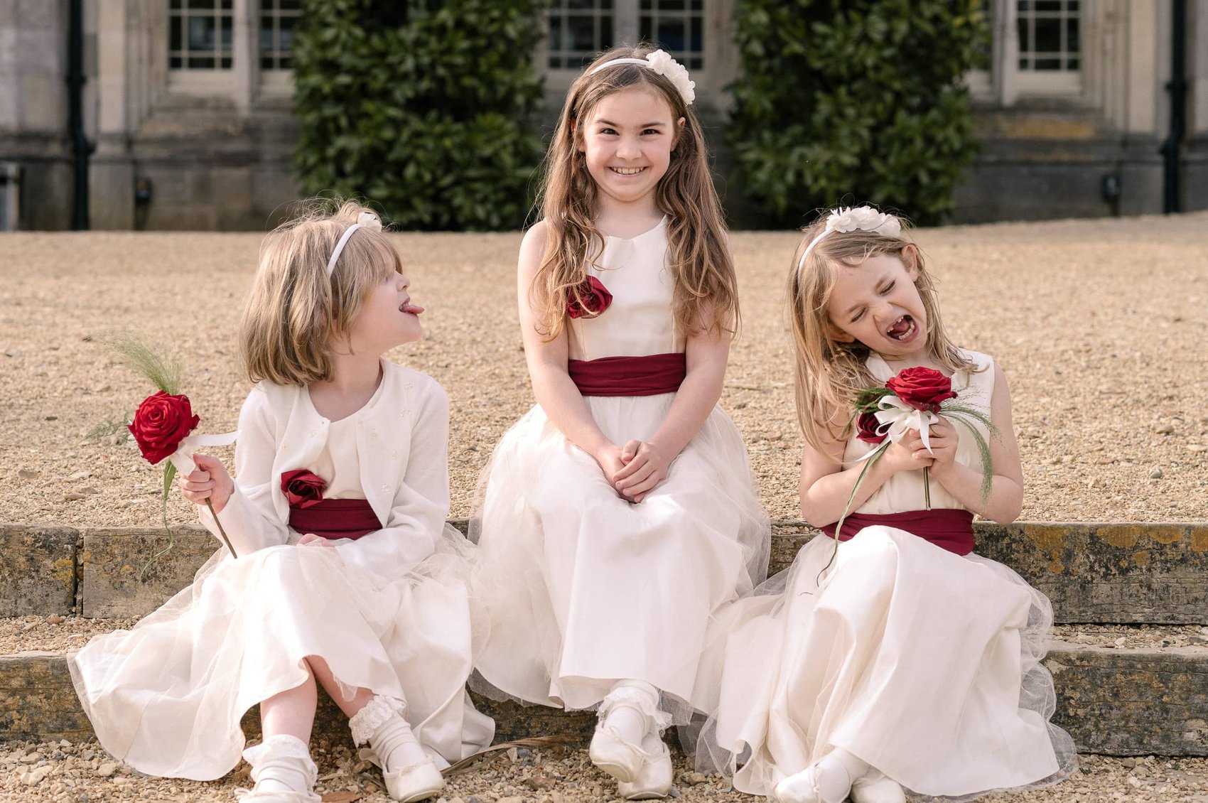 Flowergirls pull funny faces at Highcliffe castle wedding