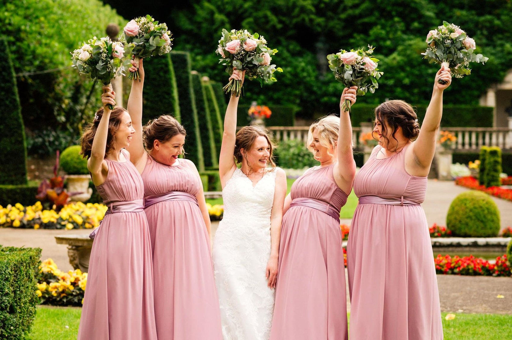 Bride and her bridemaids in blush pink coloured dresses at The Italian Villa in Poole