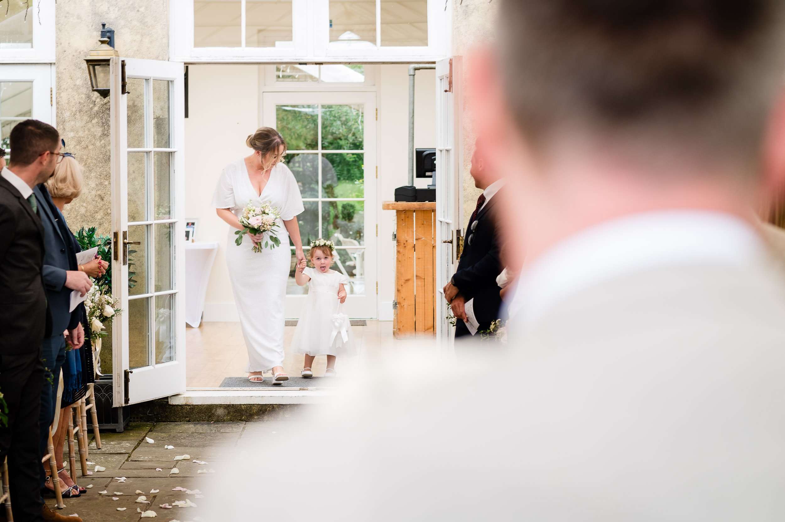 groom sees his daughter the flowergirl at the end of the aisle at Hethfelton House wedding