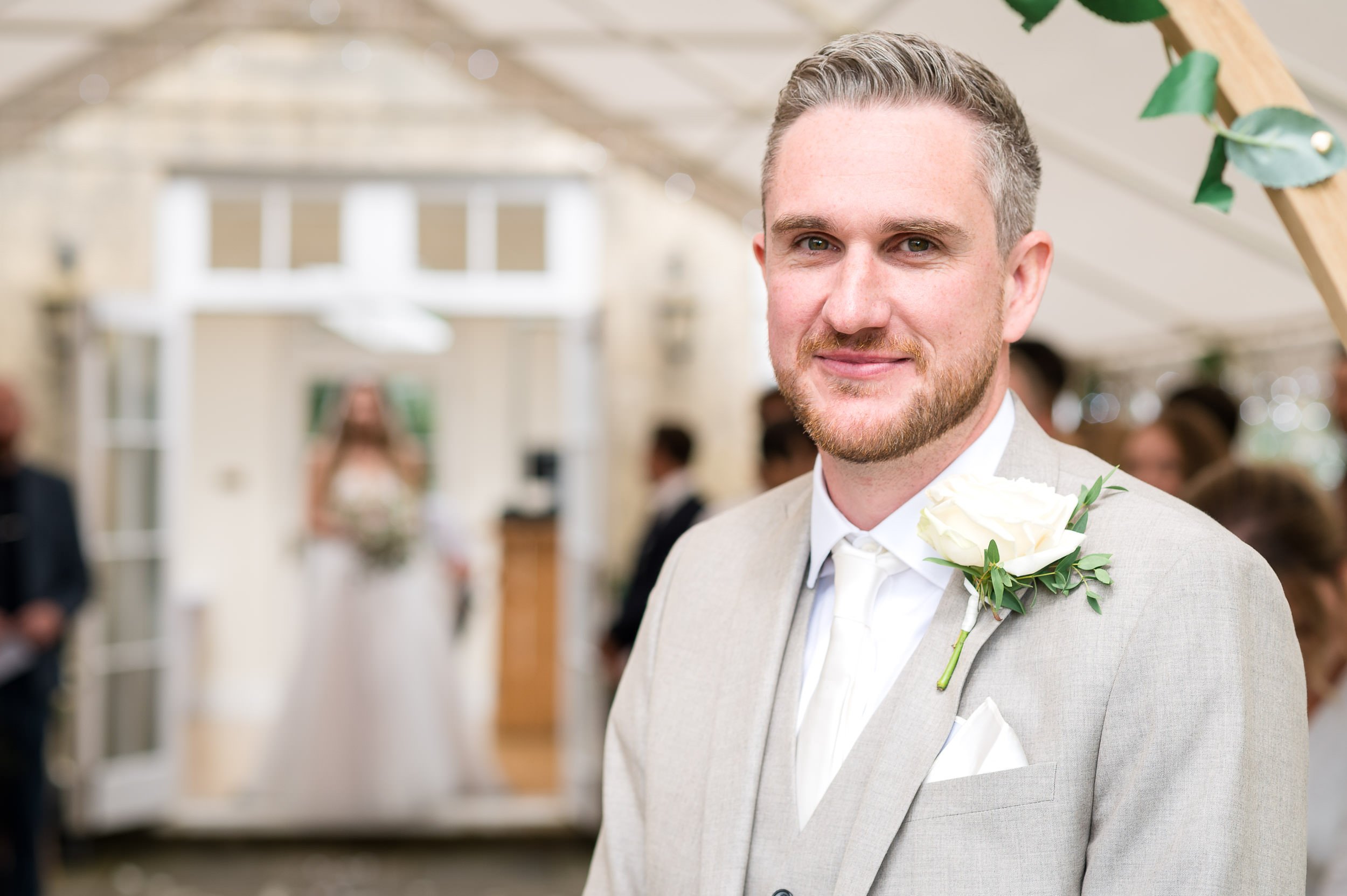 Groom takes a breath at Hethfelton House wedding before he turns to see his bride walk the aisle