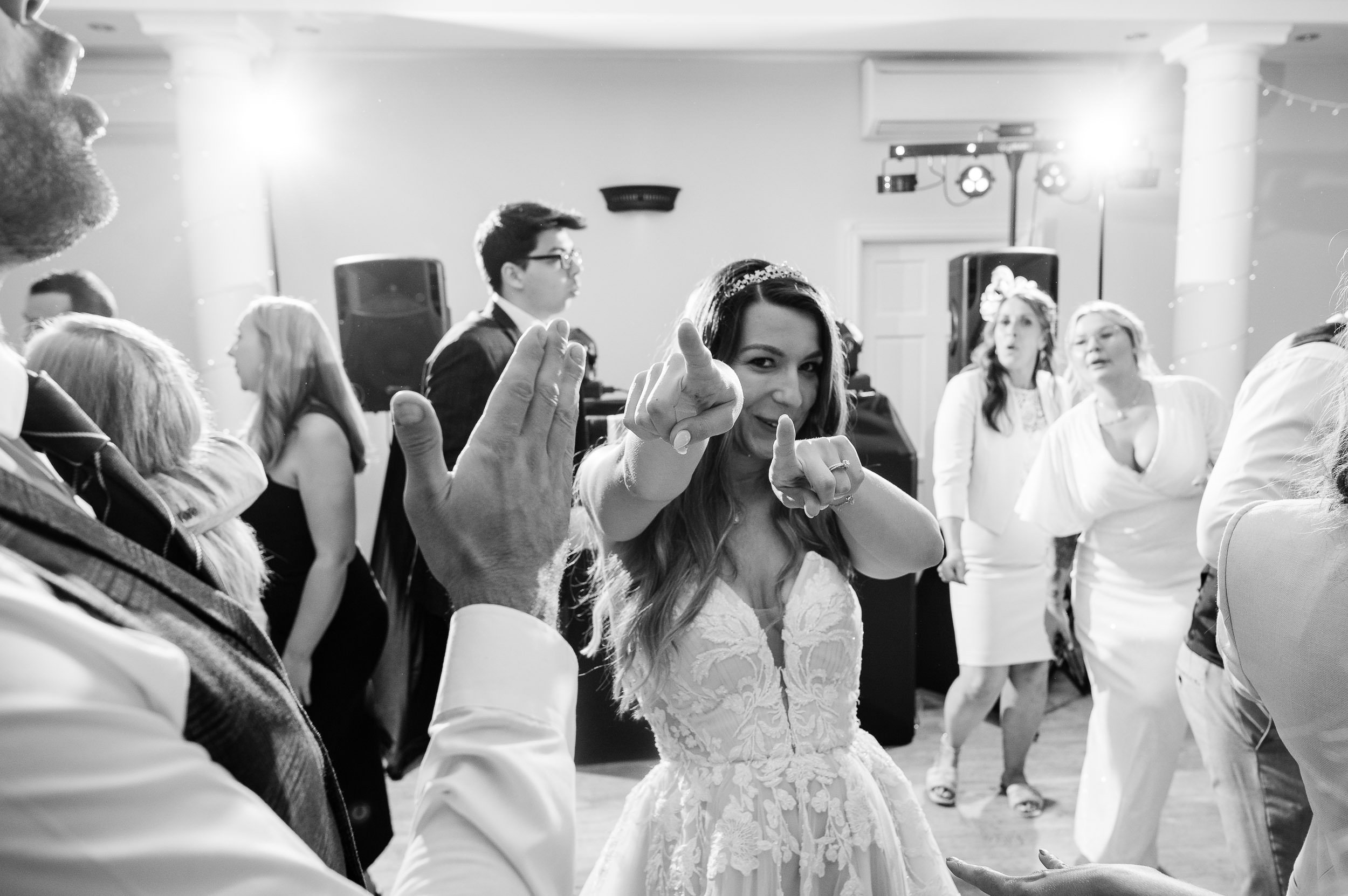 Bride throwing shapes on the dancefloor