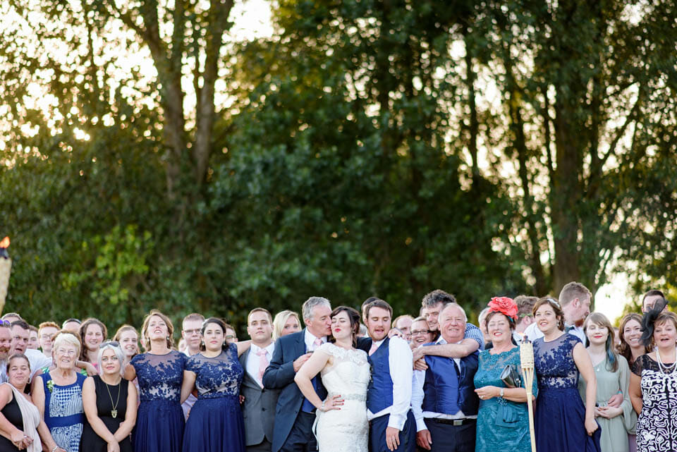 Brides dad has fun during the group photo