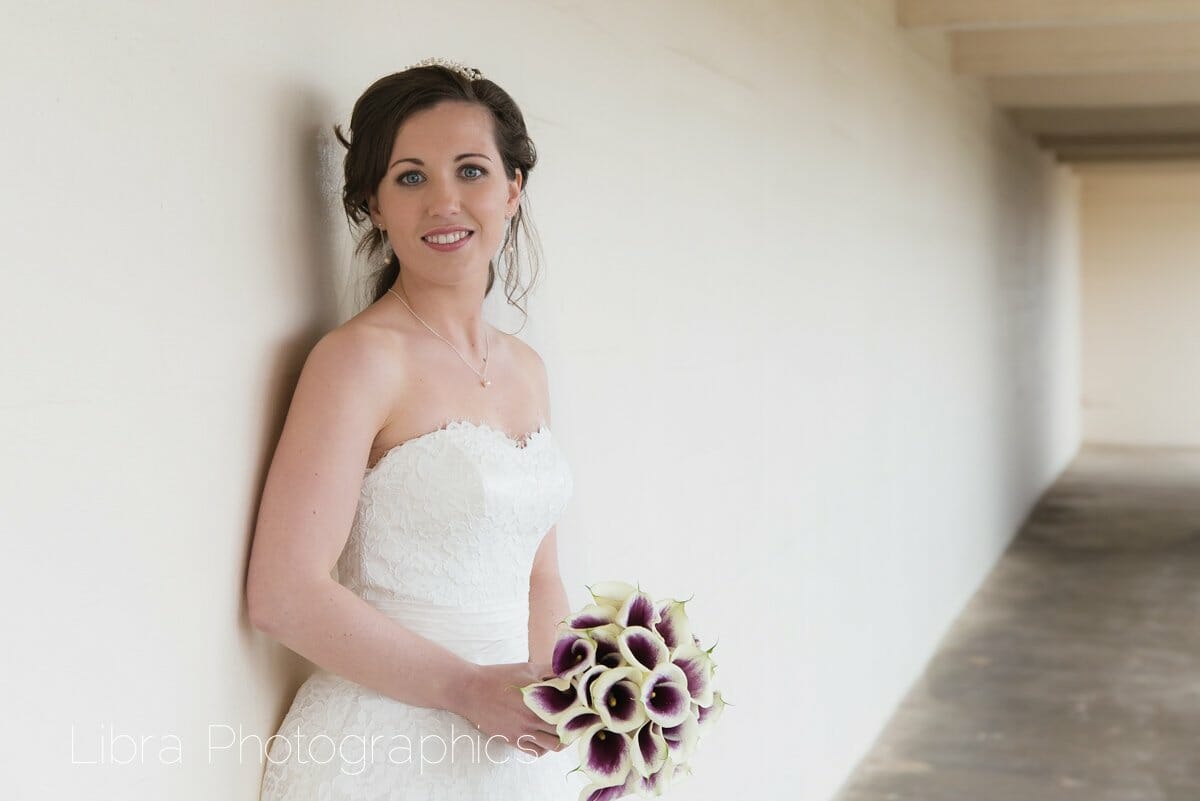 Bride poses by Sandbanks Carpark