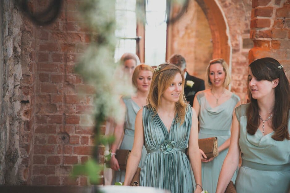 Bridesmaids lead the Bride in