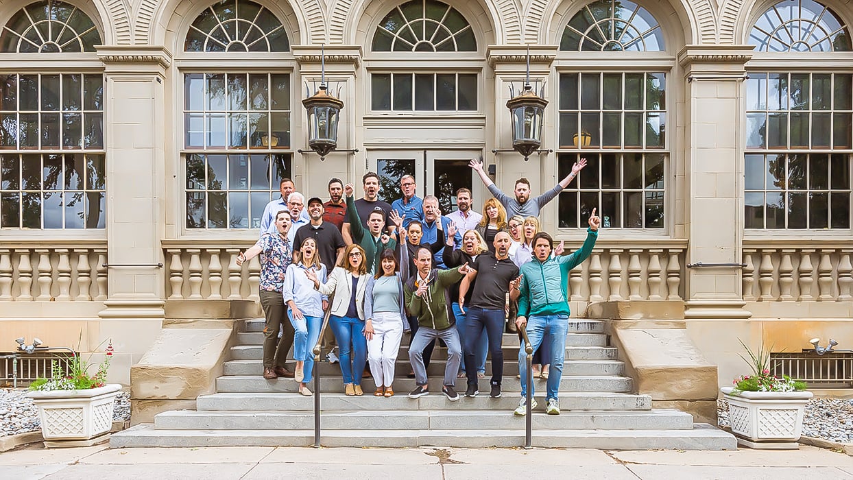 Large landscape image showing additional Unbridled team culture