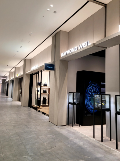 Display inside a luxury watch boutique in a shopping mall corridor