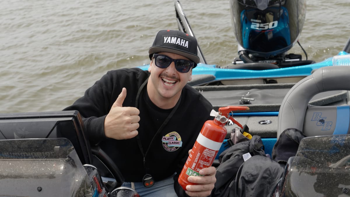 Thumbs up for the safety check, fire extinguisher in hand