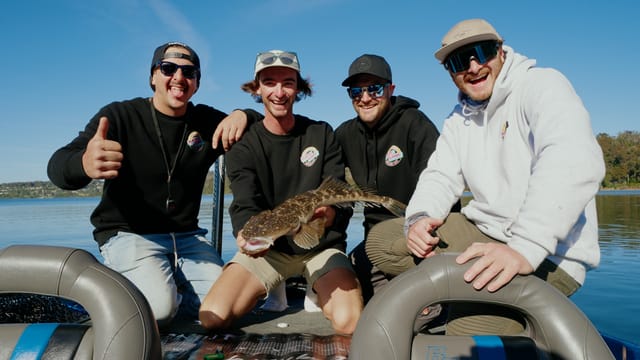 Four mates mugging for the camera with a little flathead