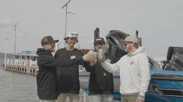 The crew toasting cans dockside