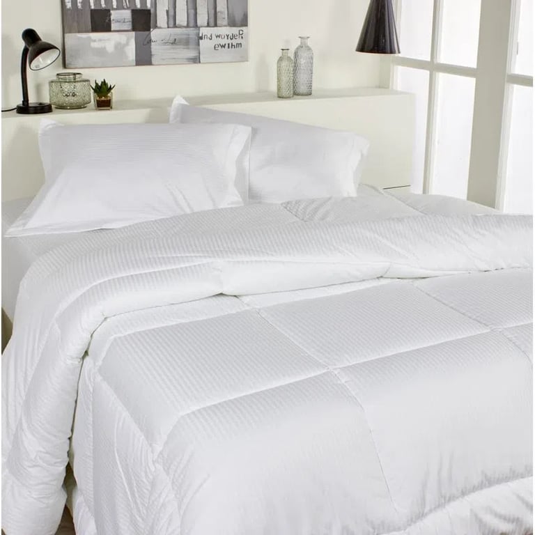 Model wearing women's burgundy red crewneck artwork tee with small white triangle overlapping larger black triangle.