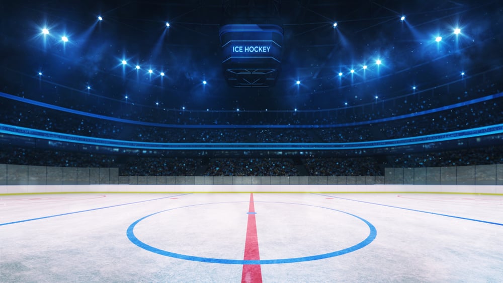 Ice,Hockey,Rink,And,Illuminated,Indoor,Arena,With,Fans,,Face