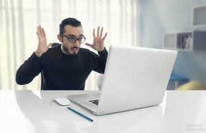 Man surprised with computer