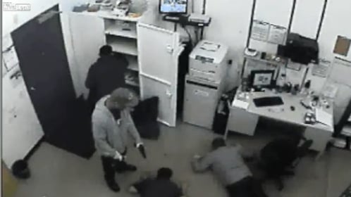 [VIDEO] Employees robbed at gunpoint, what would you have done?
