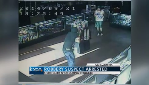 [VIDEO] Shop Employee Gets Shot By Armed Robber And Still Stays In The Fight