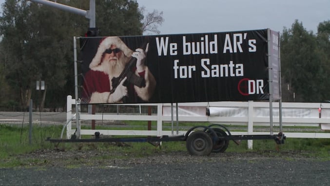 Holiday Gun Range Billboard Causes a Stir Among Residents
