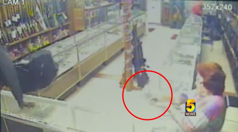 [VIDEO] Pawn Shop Employee Returns Fire On Armed Robbers, Incident Caught On Camera