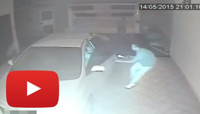Intense Video Shows Man Shooting At Armed Robbers Entering His Garage