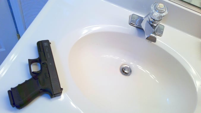 Forgetful Gun Owner Leaves Handgun On Bathroom Sink In Pizza Shop, Handed Misdemeanor Charge