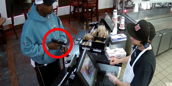 [VIDEO] Armed Robber Tries To Chamber Round During Hold-up, Fails To Feed, Cashier Calmly Hands Over Cash