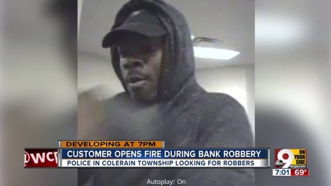Bank Robber And Customer Exchange Gunfire