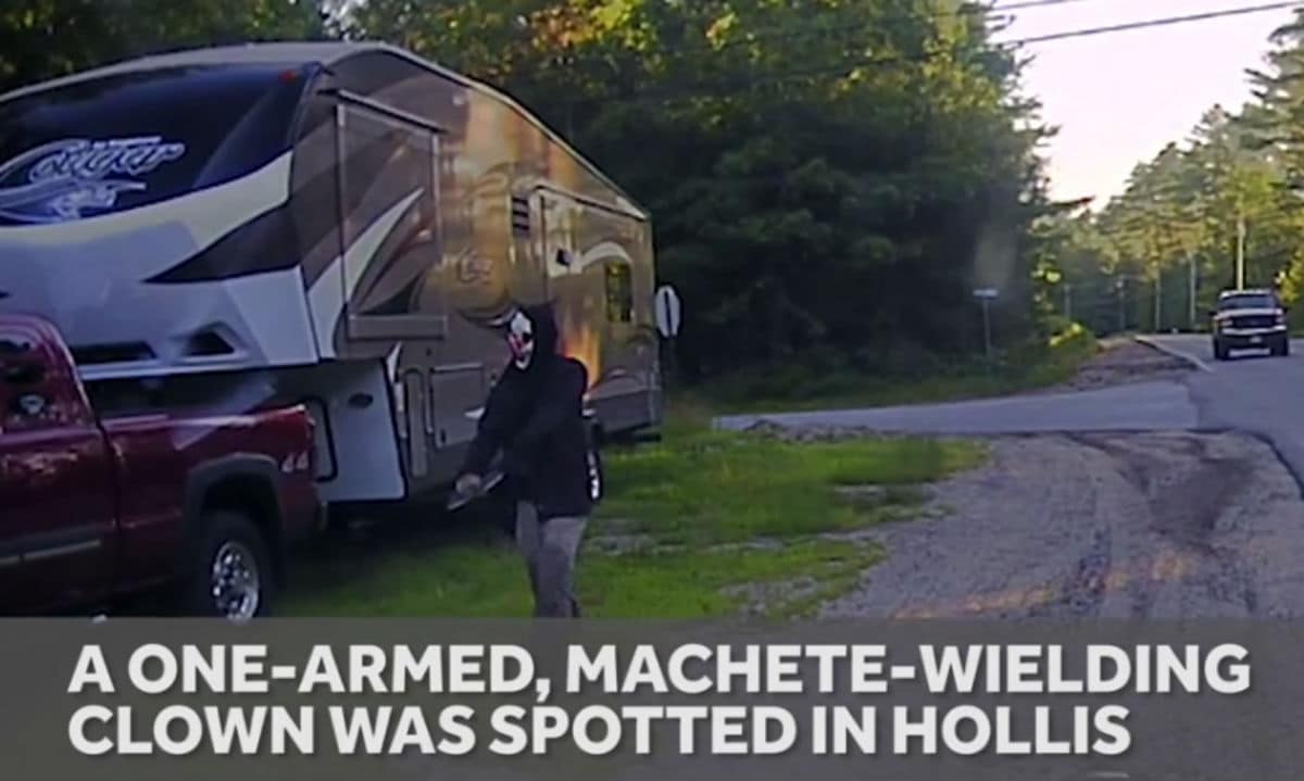 Man, Wearing Clown Mask, Strolls Down Street With Machete Taped To Amputated Arm