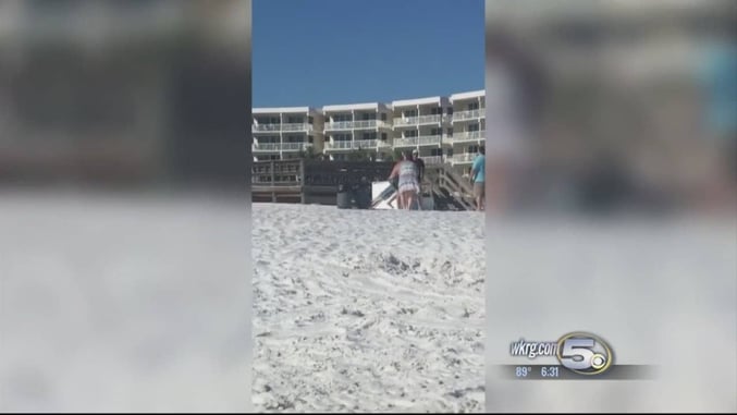 [VIDEO] Guy With Umbrella Takes Out Guy With Gun On Beach