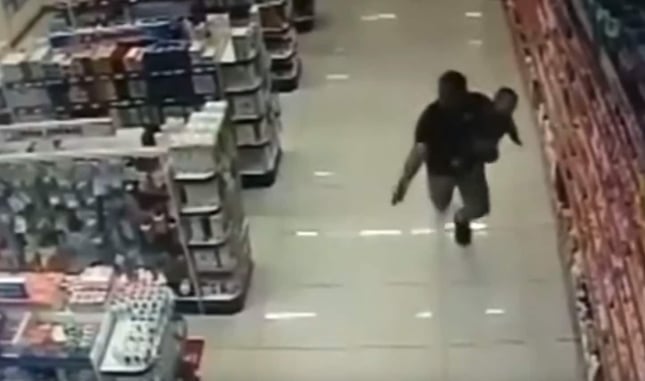 *WATCH* Two Armed Robbers Dead After Father, While Holding Infant Son, Shoots After Having Gun Pointed At Him