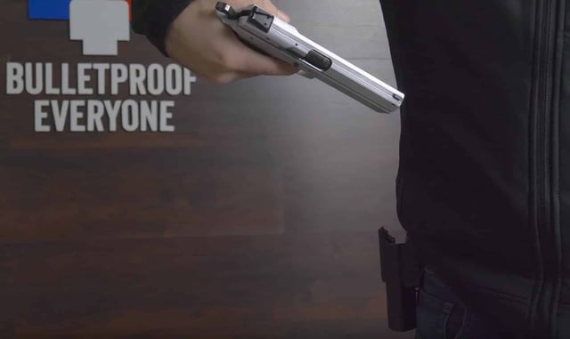 Watch This Guy Literally Stand Behind His Product: The Bulletproof Jacket. Yes, He Shoots Himself.