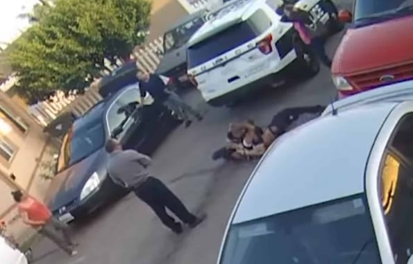 [WATCH] A Bunch Of Idiots Watch On As Officer Fights For His Life Against Violent Felon