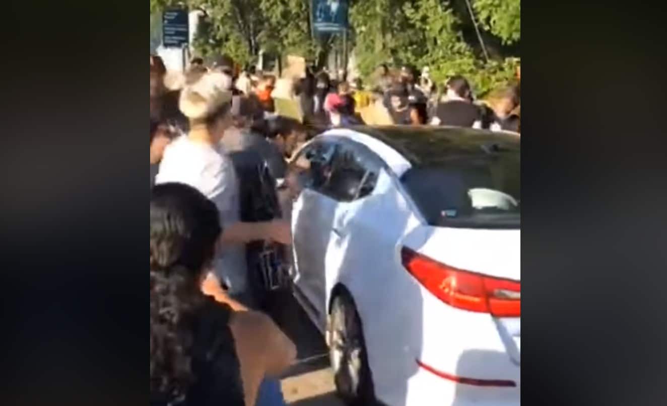 [VIDEO] Protesters Block Highway, Blocking In Vehicle With Child Inside, Smash Window